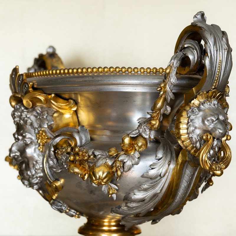 A baroque style silvered bronze urn